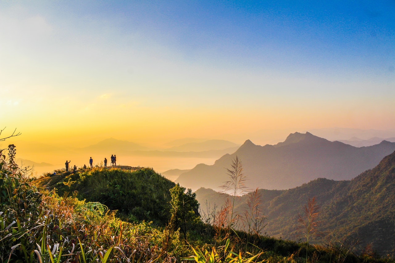 Photo Of People Standing On Top Of Mountain Near Grasses 733162 1