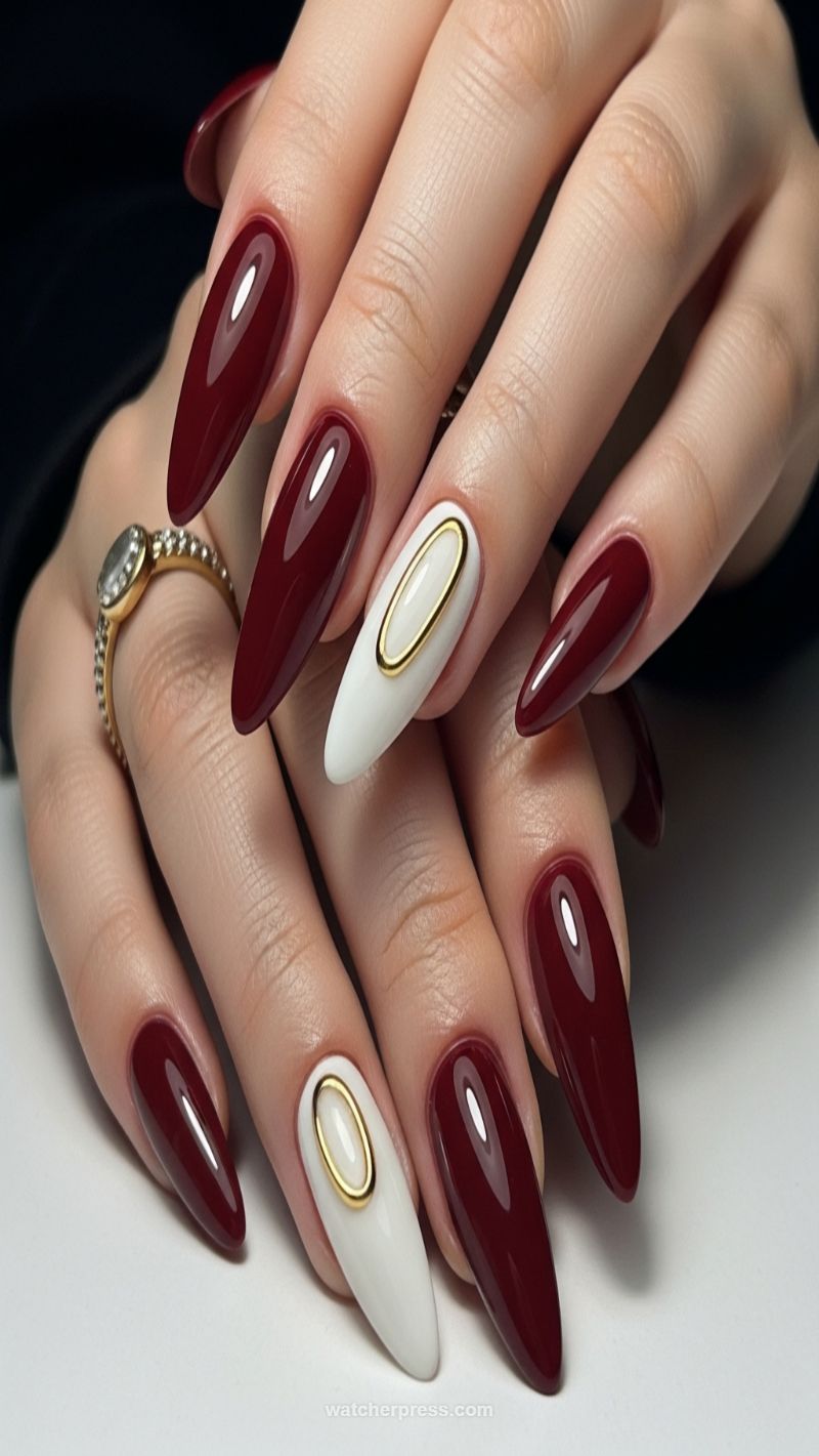 5. Luxe Deep Maroon Almond with Gold Oval Accents