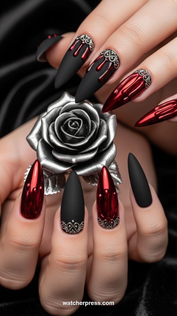 Dark Luxury: Matte Black Stiletto Nails with Metallic Red Drip and Silver Filigree