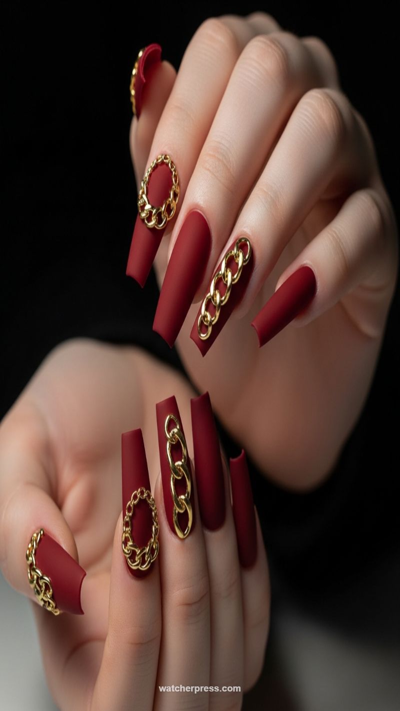 Edgy Matte Burgundy Coffin Nails with Gold Chains